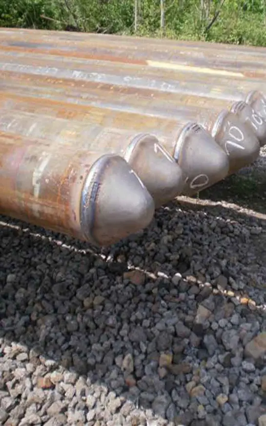 A close up of some pipes on the ground