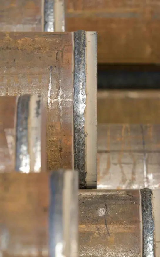 A close up of some metal bars on the side of stairs.